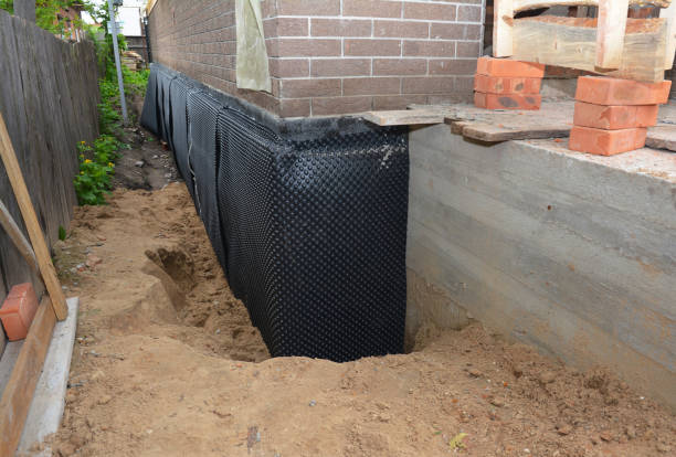 Happy homeowners after waterproofing job in Sipsey